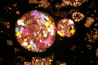 Illustration for article titled The Insides of Meteorites Are Nature's Stained Glass